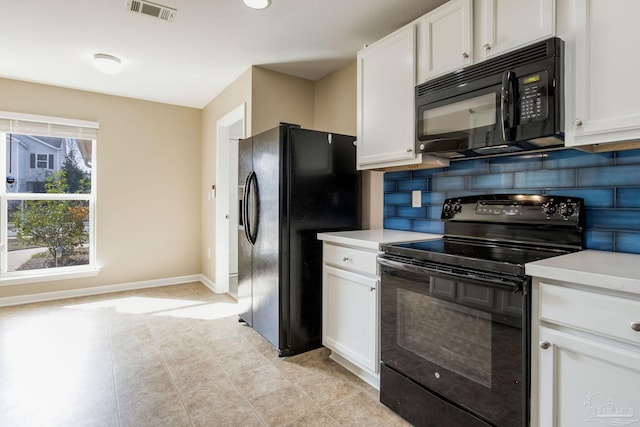 kitchen with tasteful backsplash, white cabinets, and black appliances