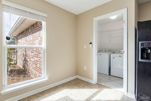 washroom featuring washer and clothes dryer