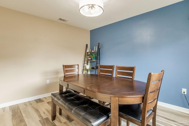 dining space featuring light hardwood / wood-style flooring