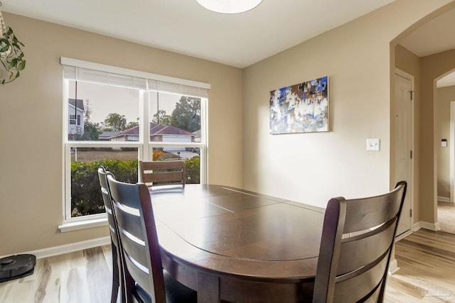 dining space featuring hardwood / wood-style flooring