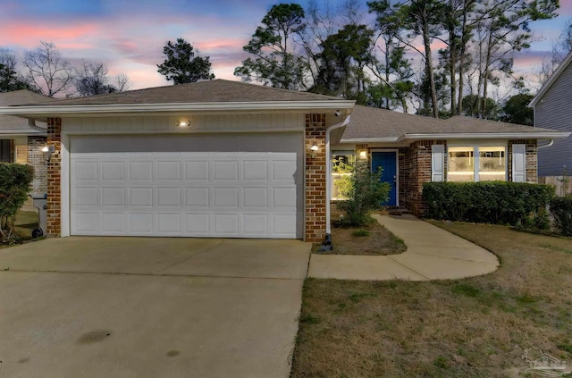 ranch-style house featuring a garage