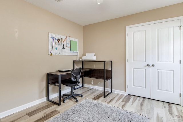 office area with light hardwood / wood-style flooring