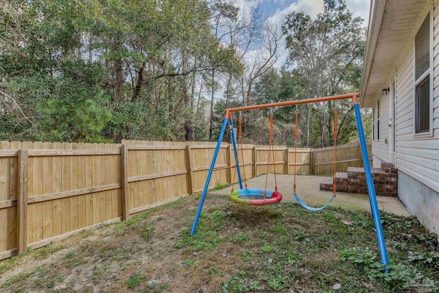 view of playground with a patio