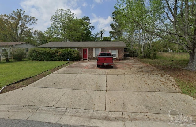 913 Bartow Ave, Pensacola, FL 32507 - ranch-style house featuring driveway, a front lawn, and brick siding