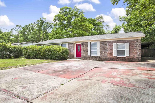913 Bartow Ave, Pensacola, FL 32507 - ranch-style house with brick siding and a front lawn