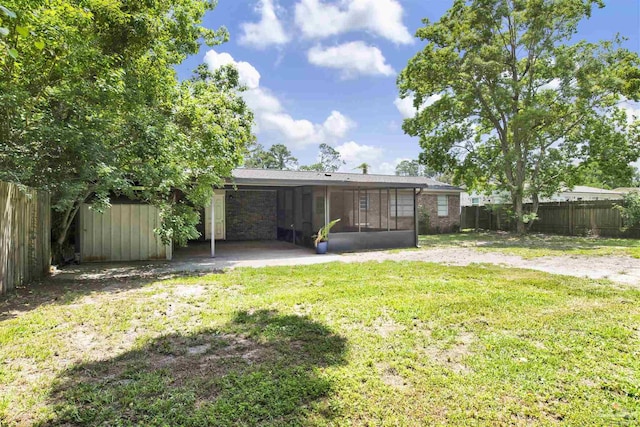 913 Bartow Ave, Pensacola, FL 32507 - rear view of property featuring a sunroom