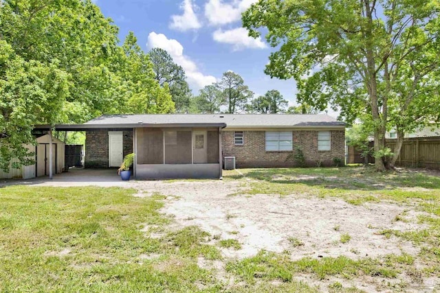 913 Bartow Ave, Pensacola, FL 32507 - view of front of house with a sunroom and brick siding