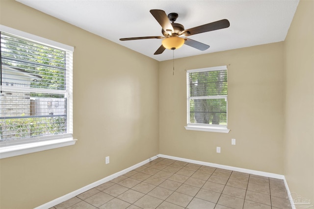 913 Bartow Ave, Pensacola, FL 32507 - unfurnished room featuring plenty of natural light, light tile patterned flooring, and ceiling fan