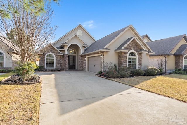 view of front of house with a garage and a front yard