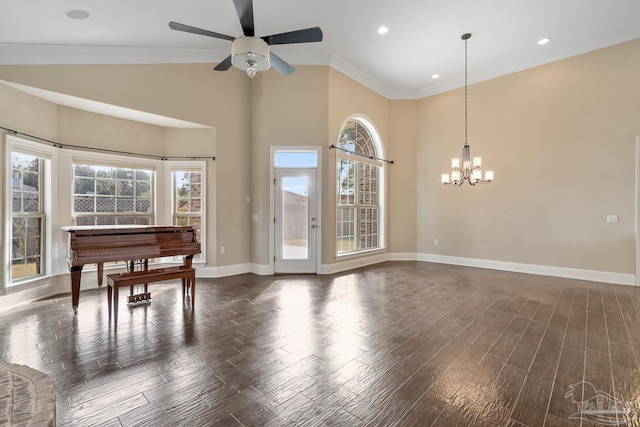 living room with ceiling fan with notable chandelier, dark hardwood / wood-style floors, and ornamental molding