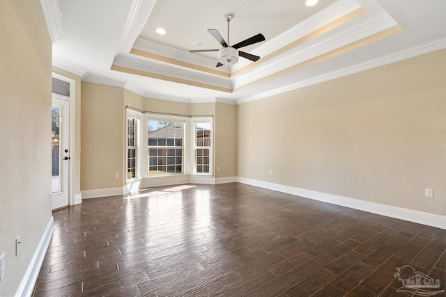 unfurnished room featuring ceiling fan, a tray ceiling, and ornamental molding