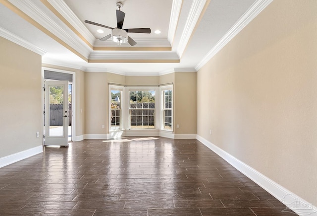 unfurnished living room featuring ceiling fan, a tray ceiling, and crown molding