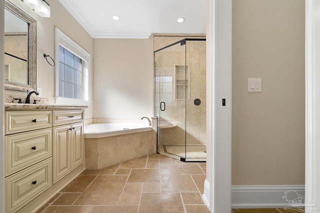 bathroom with vanity, ornamental molding, and separate shower and tub