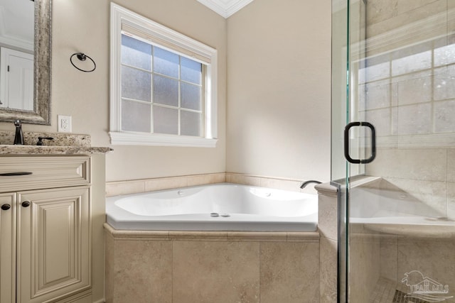 bathroom featuring vanity, ornamental molding, and separate shower and tub