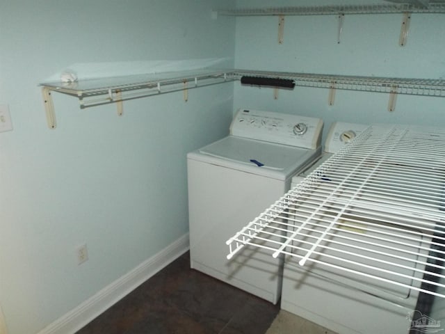 washroom featuring washer / clothes dryer and baseboards
