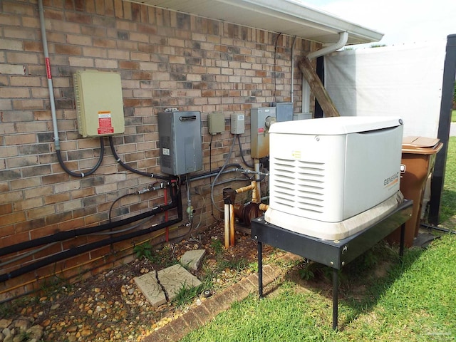 exterior view of a power unit, electric meter, and stone siding