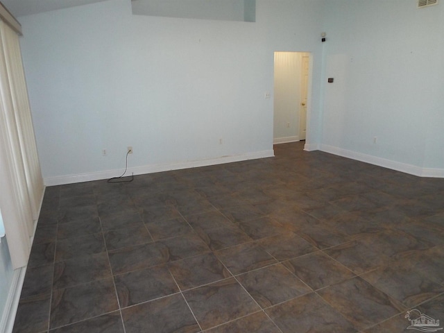 empty room featuring baseboards