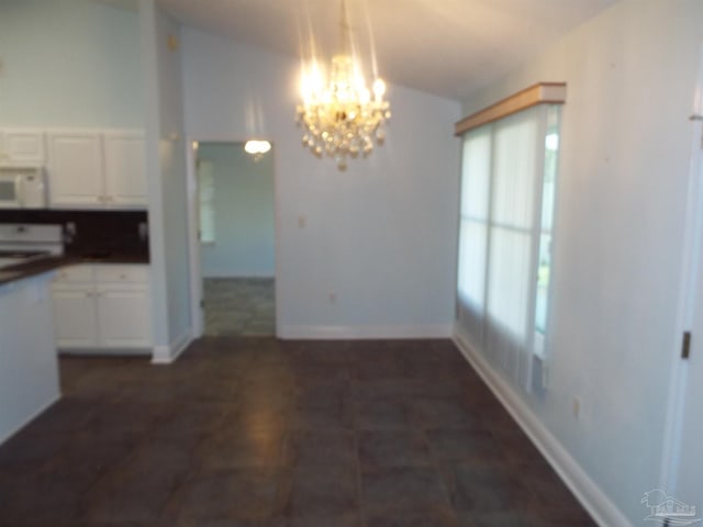 unfurnished dining area with vaulted ceiling and a chandelier