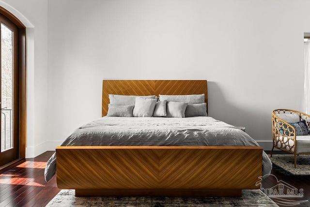 bedroom featuring dark wood-type flooring