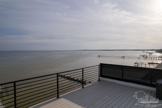 wooden deck featuring a water view