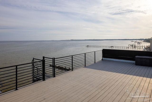 wooden deck with a water view