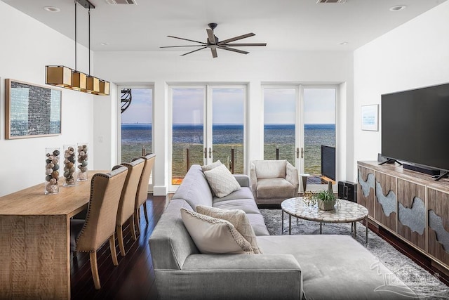 living room with dark wood-type flooring and ceiling fan