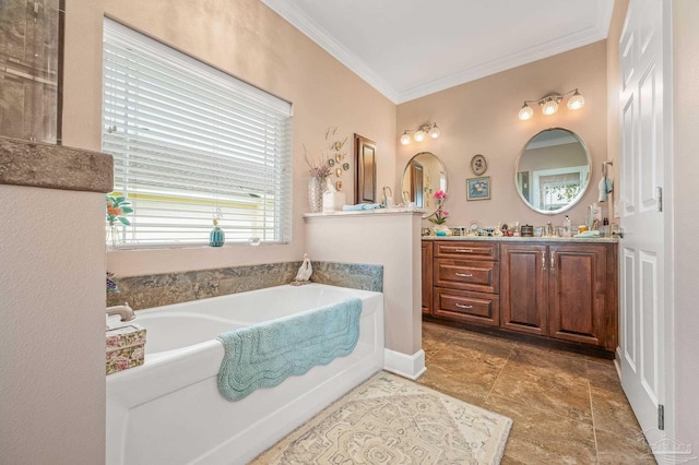 5757 Cobble Creek Dr, Pace, FL 32571 - bathroom featuring crown molding, double vanity, and a garden tub