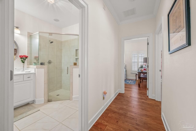 5757 Cobble Creek Dr, Pace, FL 32571 - hall featuring crown molding, light wood-style flooring, and baseboards
