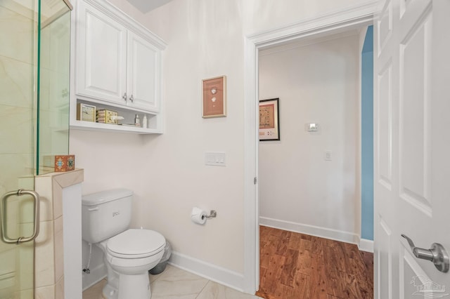 5757 Cobble Creek Dr, Pace, FL 32571 - full bath featuring baseboards, a stall shower, toilet, and wood finished floors