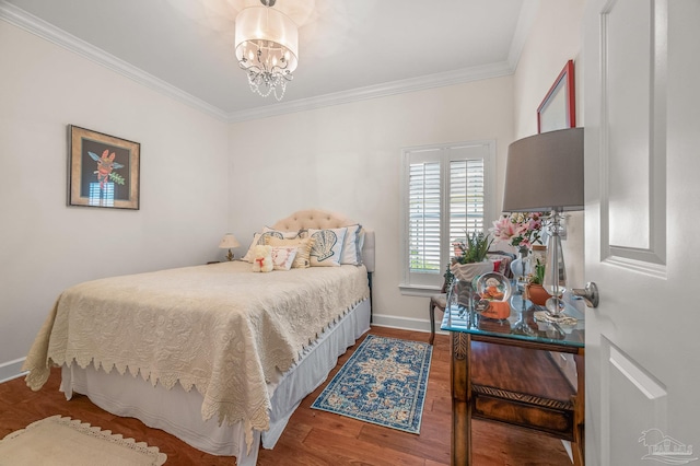 5757 Cobble Creek Dr, Pace, FL 32571 - bedroom with crown molding, a chandelier, wood finished floors, and baseboards