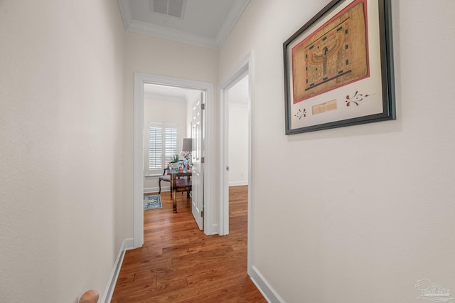 5757 Cobble Creek Dr, Pace, FL 32571 - hall featuring crown molding, wood finished floors, and baseboards