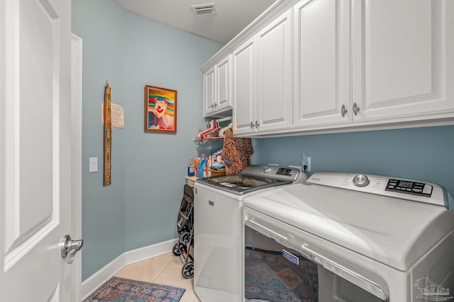 5757 Cobble Creek Dr, Pace, FL 32571 - washroom with washing machine and dryer, cabinet space, baseboards, and light tile patterned floors