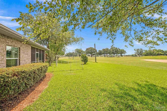 5757 Cobble Creek Dr, Pace, FL 32571 - view of green lawn with a sunroom