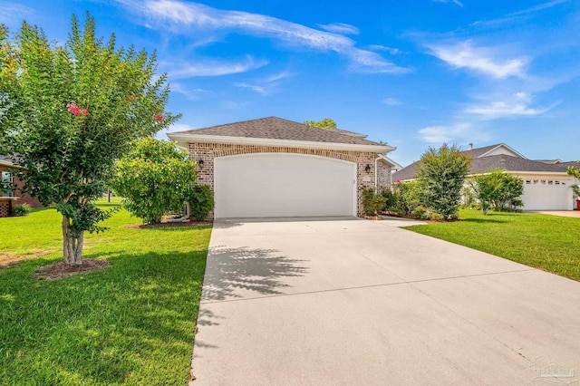5757 Cobble Creek Dr, Pace, FL 32571 - view of front of house with brick siding, a front yard, driveway, and a garage
