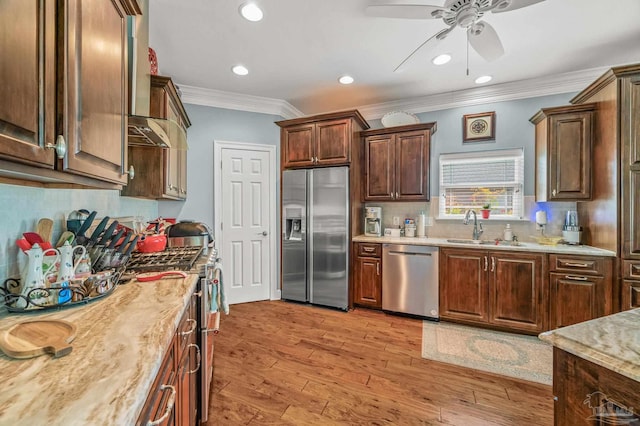 5757 Cobble Creek Dr, Pace, FL 32571 - kitchen with appliances with stainless steel finishes, a sink, ornamental molding, a ceiling fan, and tasteful backsplash