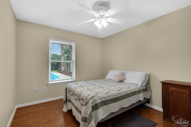 3774 Mcnemar Ct, Gulf Breeze, FL 32563 - bedroom featuring dark wood-style flooring, baseboards, and a ceiling fan