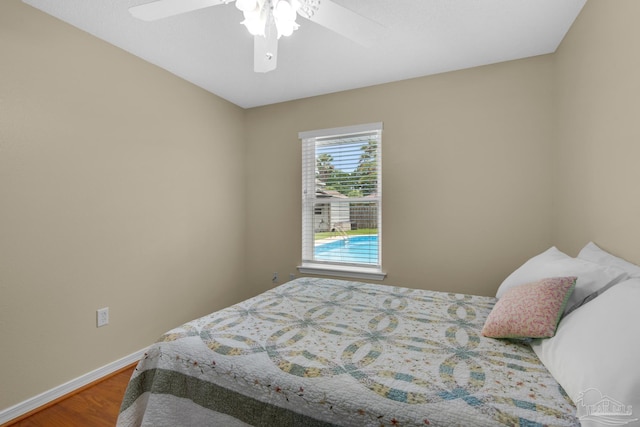 3774 Mcnemar Ct, Gulf Breeze, FL 32563 - bedroom featuring wood finished floors, baseboards, and ceiling fan