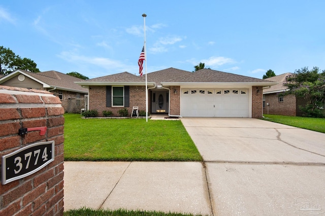 3774 Mcnemar Ct, Gulf Breeze, FL 32563 - view of front facade featuring a garage, a front yard, concrete driveway, and brick siding
