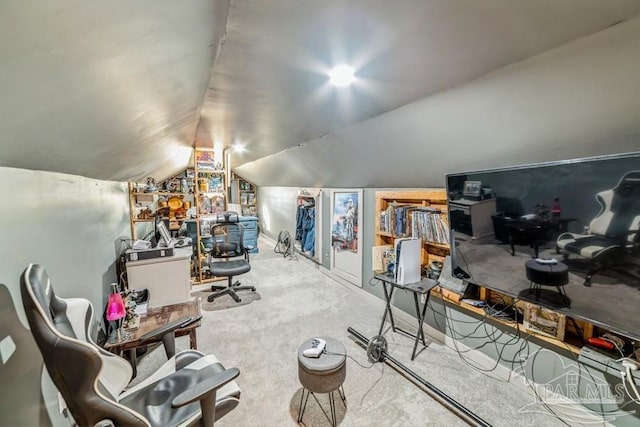 interior space featuring carpet floors and lofted ceiling