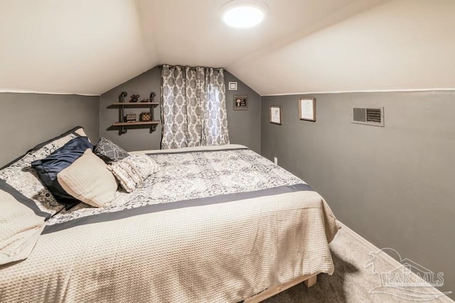 bedroom featuring carpet floors and lofted ceiling