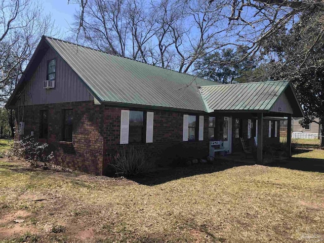 view of front facade with metal roof and brick siding