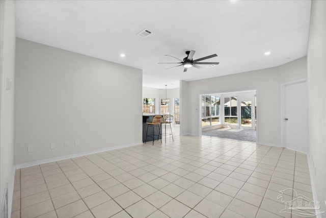 unfurnished living room featuring light tile patterned floors, recessed lighting, visible vents, a ceiling fan, and baseboards