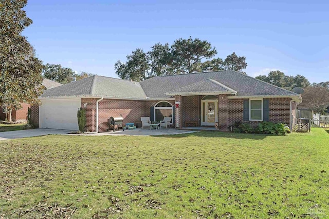 single story home featuring a patio area, a front lawn, and a garage