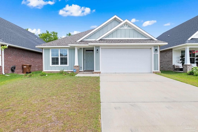 3826 Ranch Rd, Pace, FL 32571 - view of front facade featuring driveway, board and batten siding, an attached garage, a front yard, and roof with shingles
