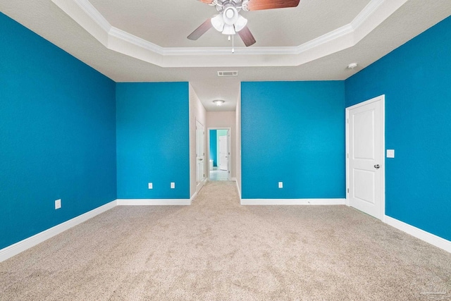 3826 Ranch Rd, Pace, FL 32571 - unfurnished bedroom featuring crown molding, a tray ceiling, visible vents, and carpet
