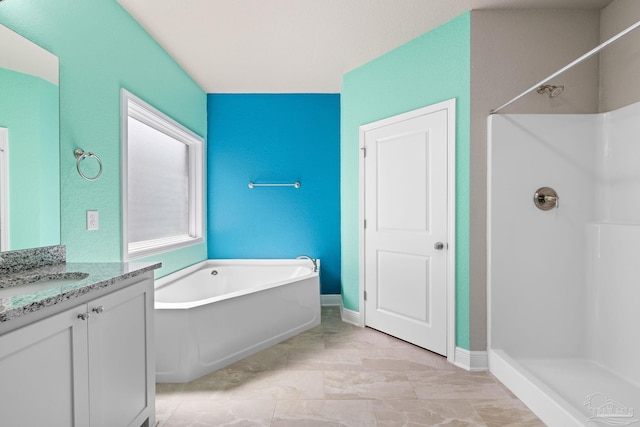 3826 Ranch Rd, Pace, FL 32571 - bathroom with baseboards, walk in shower, a garden tub, and vanity