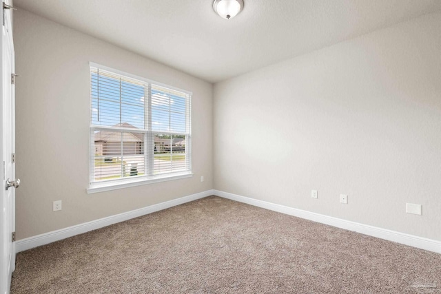 3826 Ranch Rd, Pace, FL 32571 - spare room with baseboards and carpet