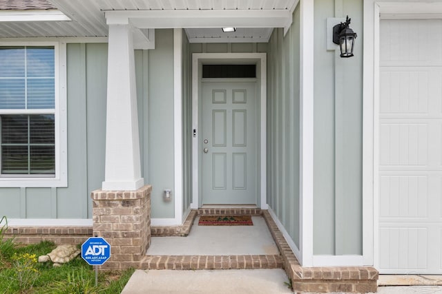3826 Ranch Rd, Pace, FL 32571 - view of exterior entry with board and batten siding