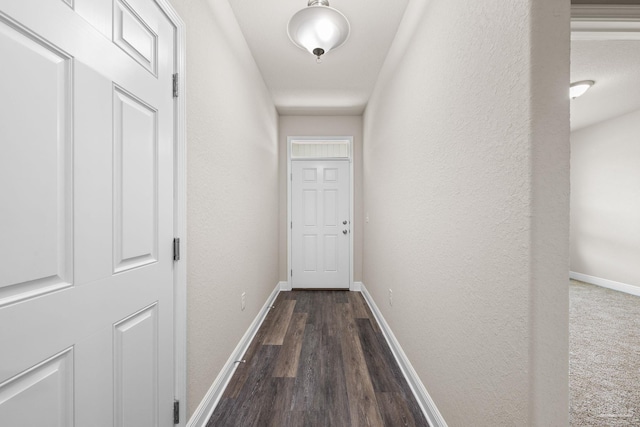 3826 Ranch Rd, Pace, FL 32571 - corridor featuring baseboards, a textured wall, and dark wood-style floors
