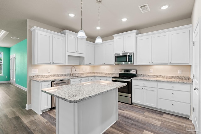 3826 Ranch Rd, Pace, FL 32571 - kitchen with white cabinetry, appliances with stainless steel finishes, a sink, and visible vents